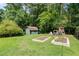 Spacious backyard with garden beds, playset, and storage shed, perfect for Gathering fun at 2575 Dobbs Nw Dr, Kennesaw, GA 30152