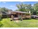 Manicured backyard featuring a wooden deck, lush lawn, and privacy fencing, perfect for entertaining at 2575 Dobbs Nw Dr, Kennesaw, GA 30152