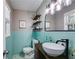 Stylish bathroom featuring a tiled wall, rounded sink with black faucet, and a window at 2575 Dobbs Nw Dr, Kennesaw, GA 30152