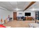 Large living room with a TV, shelving units, a door and a play area at 2575 Dobbs Nw Dr, Kennesaw, GA 30152