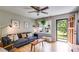Bright living room featuring hardwood floors, a ceiling fan, and stylish furniture at 2575 Dobbs Nw Dr, Kennesaw, GA 30152