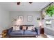Cozy living room featuring a comfortable sofa, stylish decor, and plenty of natural light at 2575 Dobbs Nw Dr, Kennesaw, GA 30152