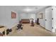 Finished basement area featuring exercise equipment and comfortable seating for relaxation at 4020 Devereux Chase, Roswell, GA 30075