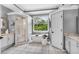 Bright bathroom featuring a sleek shower, a stand-alone tub, and a double sink vanity for modern comfort at 4020 Devereux Chase, Roswell, GA 30075
