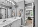 Gray bathroom featuring a double vanity, ample counter space, and an open view to the bedroom at 4020 Devereux Chase, Roswell, GA 30075