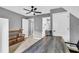 Gray bedroom featuring a ceiling fan, neutral walls, and a stylish desk space at 4020 Devereux Chase, Roswell, GA 30075