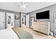 Bedroom featuring an en suite, with a large dresser under a large tv at 4020 Devereux Chase, Roswell, GA 30075