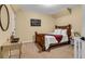Bedroom featuring a queen bed, hardwood frame, and bedside tables at 4020 Devereux Chase, Roswell, GA 30075