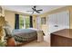 Bright bedroom featuring a ceiling fan, neutral walls, and a large window for ample natural light at 4020 Devereux Chase, Roswell, GA 30075