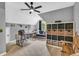 Versatile bonus room with neutral paint, ceiling fan, space for a desk and relaxation at 4020 Devereux Chase, Roswell, GA 30075