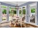 Bright breakfast nook with large windows and outdoor access, perfect for enjoying morning meals at 4020 Devereux Chase, Roswell, GA 30075