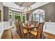 Formal dining room featuring decorative chandelier and views of the landscaped yard at 4020 Devereux Chase, Roswell, GA 30075