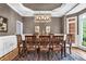Beautiful dining room with wainscotting, tray ceiling, and large windows at 4020 Devereux Chase, Roswell, GA 30075