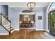 Open-concept foyer leading to formal dining area with tray ceiling detail at 4020 Devereux Chase, Roswell, GA 30075