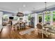 Open kitchen and dining area with a center island, stainless appliances, and view to living room at 4020 Devereux Chase, Roswell, GA 30075