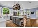 Charming kitchen featuring a center island, stainless steel appliances, and a pot rack at 4020 Devereux Chase, Roswell, GA 30075