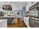 Beautiful kitchen with stainless steel appliances, a center island, and a pot rack at 4020 Devereux Chase, Roswell, GA 30075