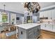 Spacious kitchen with large island, white countertops, gray cabinets and stainless appliances at 4020 Devereux Chase, Roswell, GA 30075