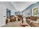 Finished basement living area boasts cozy seating, natural light, and an adjacent billiards room at 4020 Devereux Chase, Roswell, GA 30075