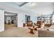 Finished basement living area showcases natural light, billiards room, and doorway to a gym at 4020 Devereux Chase, Roswell, GA 30075
