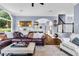 Open-concept living room featuring hardwood floors and an arched doorway leading to other areas at 4020 Devereux Chase, Roswell, GA 30075