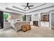 Relaxing main bedroom featuring tray ceiling, fireplace, built-in shelving, and neutral tones at 4020 Devereux Chase, Roswell, GA 30075