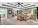 Serene main bedroom with tray ceilings, neutral colors, sitting area, and ensuite bathroom access at 4020 Devereux Chase, Roswell, GA 30075
