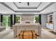 A beautiful main bedroom boasts tray ceilings, a decorative bed, and large windows that flood the room with natural light at 4020 Devereux Chase, Roswell, GA 30075