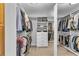 Walk-in closet features extensive storage with organized shelving and hanging space for clothes and accessories at 4020 Devereux Chase, Roswell, GA 30075
