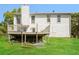 Back exterior of house shows a deck, backyard and mature trees at 2325 E Hill Way, Norcross, GA 30071