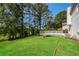Large backyard with deck and mature trees provides a private outdoor space at 2325 E Hill Way, Norcross, GA 30071
