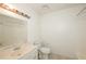 Small bathroom featuring a vanity with sink, toilet, and shower-tub combo at 2325 E Hill Way, Norcross, GA 30071