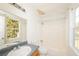 Well-lit bathroom featuring a vanity, toilet, and shower-tub combo at 2325 E Hill Way, Norcross, GA 30071