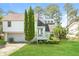 Charming two-story home with a well-manicured lawn and a welcoming front porch at 2325 E Hill Way, Norcross, GA 30071