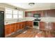 Spacious kitchen features ample cabinet space, stainless steel appliances, and bright natural light at 2325 E Hill Way, Norcross, GA 30071
