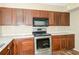 Kitchen showcasing stainless steel appliances, countertops, and ample cabinetry at 2325 E Hill Way, Norcross, GA 30071