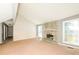 Spacious living room with a stone fireplace, ample natural light, and neutral walls at 2325 E Hill Way, Norcross, GA 30071
