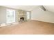 Inviting living room featuring a stone fireplace and natural light from large windows at 2325 E Hill Way, Norcross, GA 30071