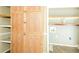 Built-in wooden pantry cabinets provide space for storage at 2325 E Hill Way, Norcross, GA 30071
