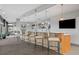 Stylish bar area with seating, pendant lighting, shelving, and a TV, perfect for entertaining guests at 250 Pharr Ne Rd # 1814, Atlanta, GA 30305