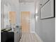 Modern condo entryway with stylish console table, mirrors, and contemporary decor, creating an inviting first impression at 250 Pharr Ne Rd # 1814, Atlanta, GA 30305