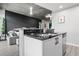 Modern kitchen with black backsplash, stainless steel appliances and a kitchen island with a breakfast bar at 250 Pharr Ne Rd # 1814, Atlanta, GA 30305