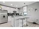 Modern kitchen with stainless steel appliances, white cabinetry and a breakfast bar with seating at 250 Pharr Ne Rd # 1814, Atlanta, GA 30305