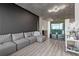 Spacious living room featuring a comfortable grey sofa, sleek decor, and modern lighting, perfect for relaxation at 250 Pharr Ne Rd # 1814, Atlanta, GA 30305