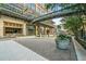 Charming street view featuring an elegant pedestrian bridge connecting shops and restaurants on a brick-paved road at 250 Pharr Ne Rd # 1814, Atlanta, GA 30305