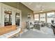 Covered back porch with comfortable seating and ceiling fan at 4708 Tiger Blvd, Duluth, GA 30096
