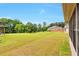 An expansive, well-maintained backyard with lush green grass and mature trees provides a private outdoor space at 4708 Tiger Blvd, Duluth, GA 30096
