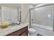 Bathroom featuring a granite countertop, a single sink, and a shower with glass doors at 4708 Tiger Blvd, Duluth, GA 30096