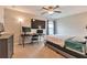 Bedroom featuring a desk, large TV, ceiling fan, and carpet flooring at 4708 Tiger Blvd, Duluth, GA 30096