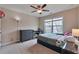 Bedroom featuring a ceiling fan, carpet flooring, a dresser, and a window at 4708 Tiger Blvd, Duluth, GA 30096